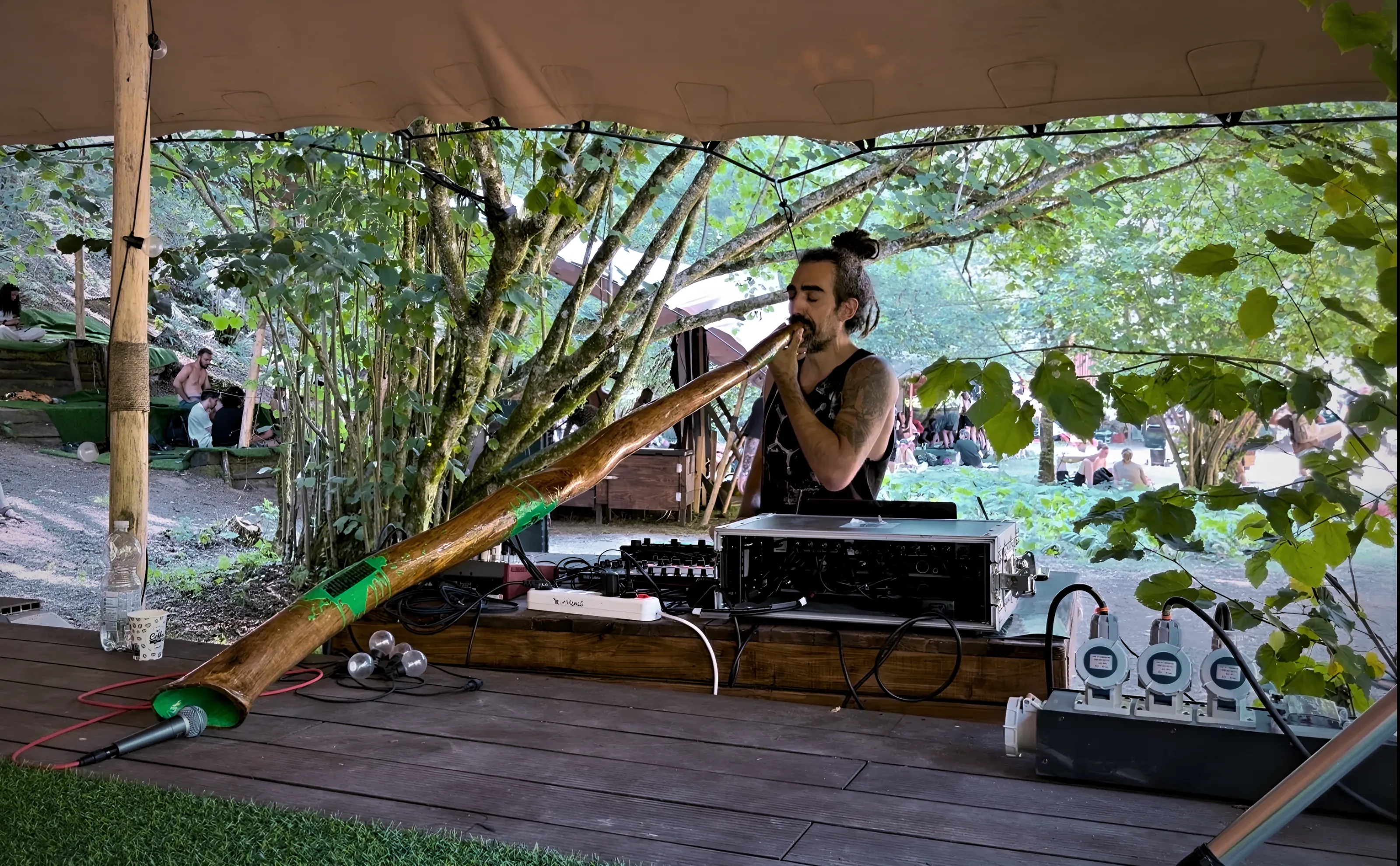 Archimedes Codex playing didgeridoo under the chill tent